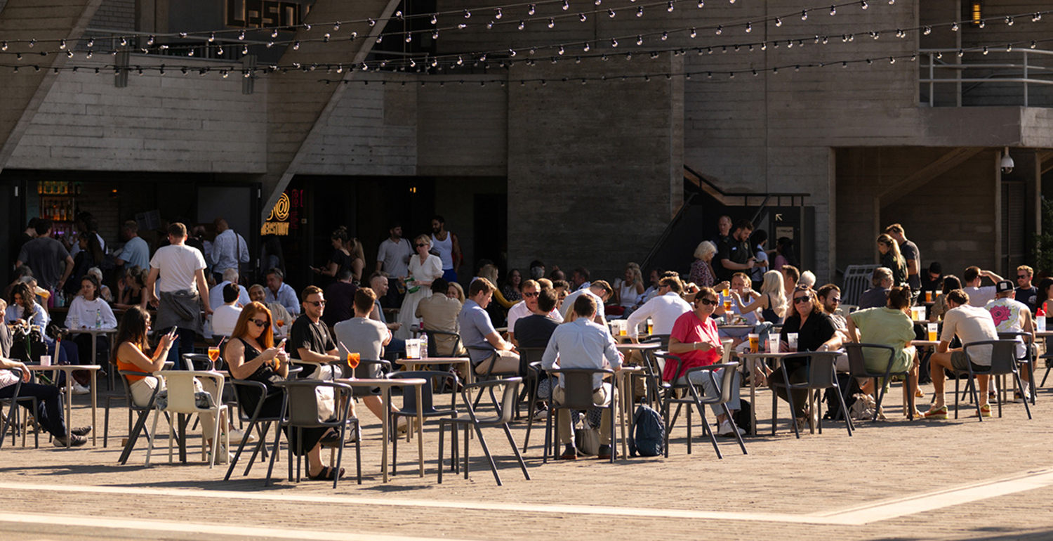 An image of people dining and drinking outside in London's Bankside area.