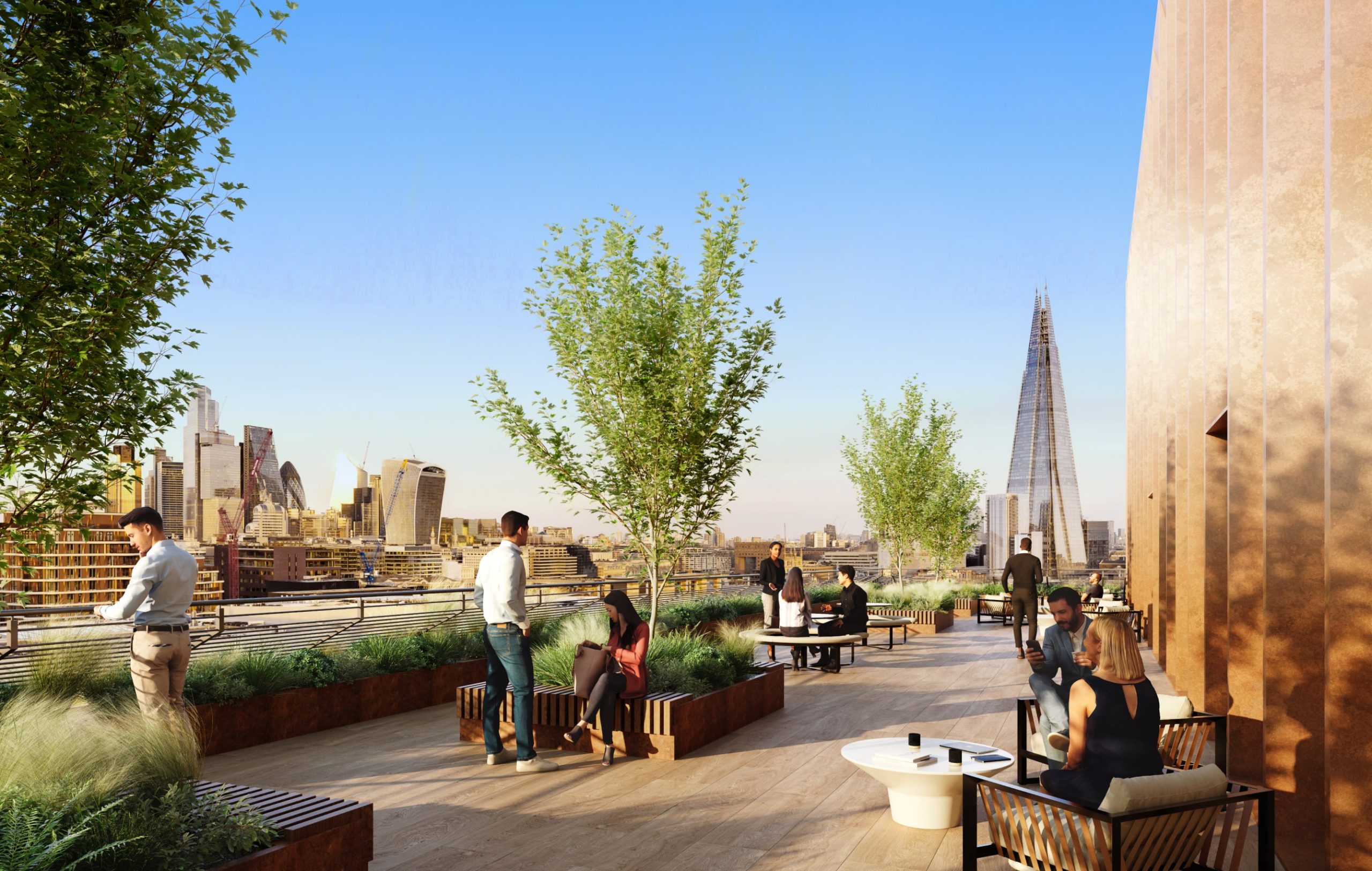 Office professionals sitting outside on a balcony enjoying the sunshine looking over the London skyline with The Shard in the background.